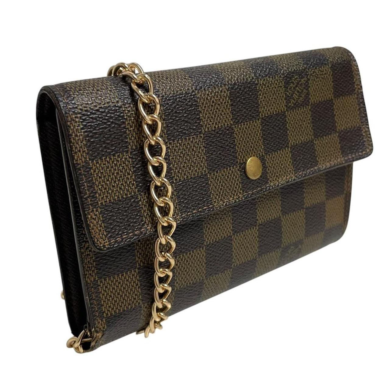 Louis Vuitton gold crossbody wallet Damier Ebene canvas with removable strap and logo.