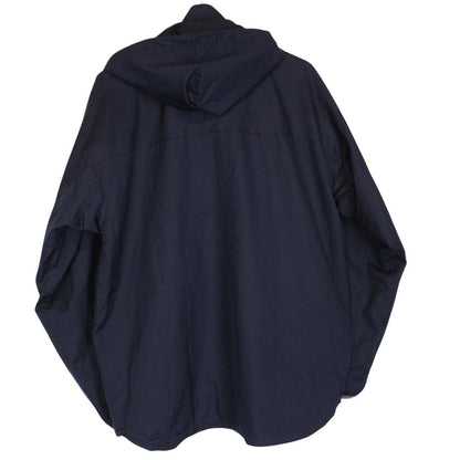Stüssy reversible nylon jacket in grey and navy blue with logo detailing.