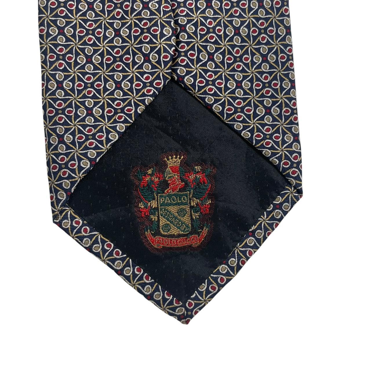 Gucci navy blue silk tie with vintage pattern and logo detail.