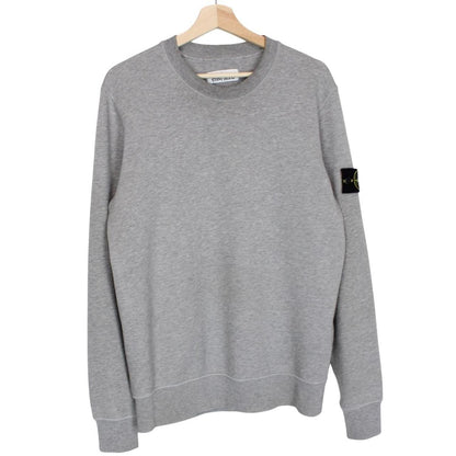 Stone Island grey cotton sweatshirt with logo patch and soft texture.