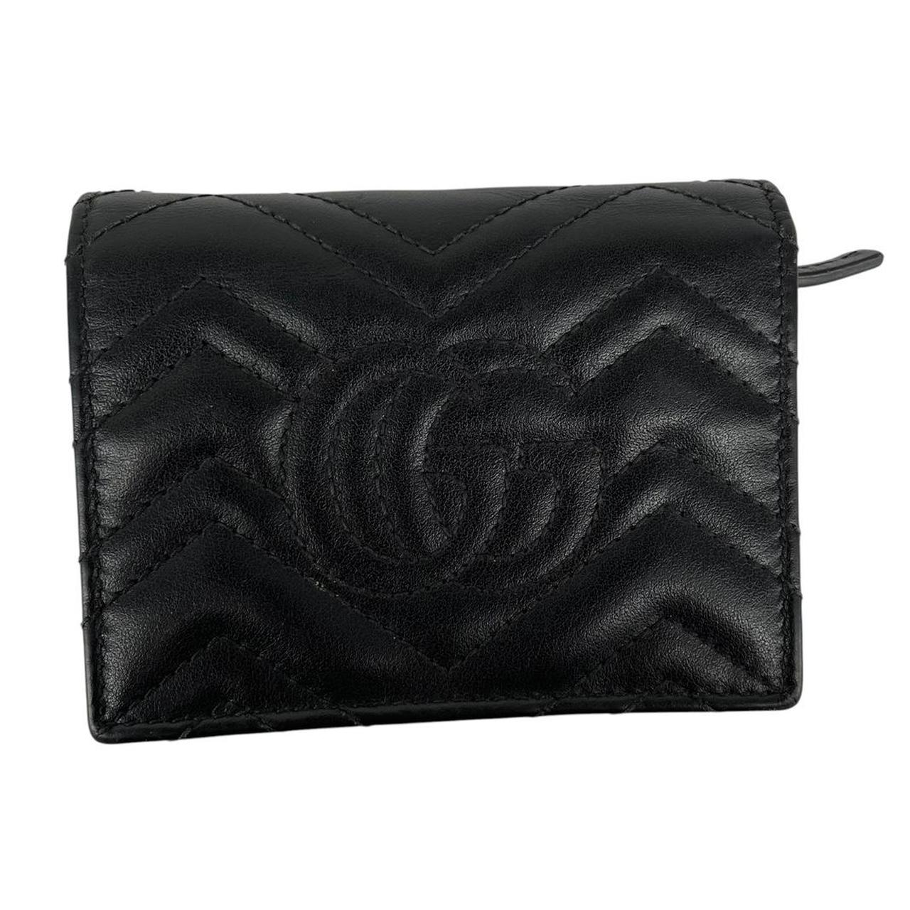 Gucci black calfskin card case wallet with matelasse pattern and GG logo.