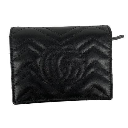 Gucci black calfskin card case wallet with matelasse pattern and GG logo.