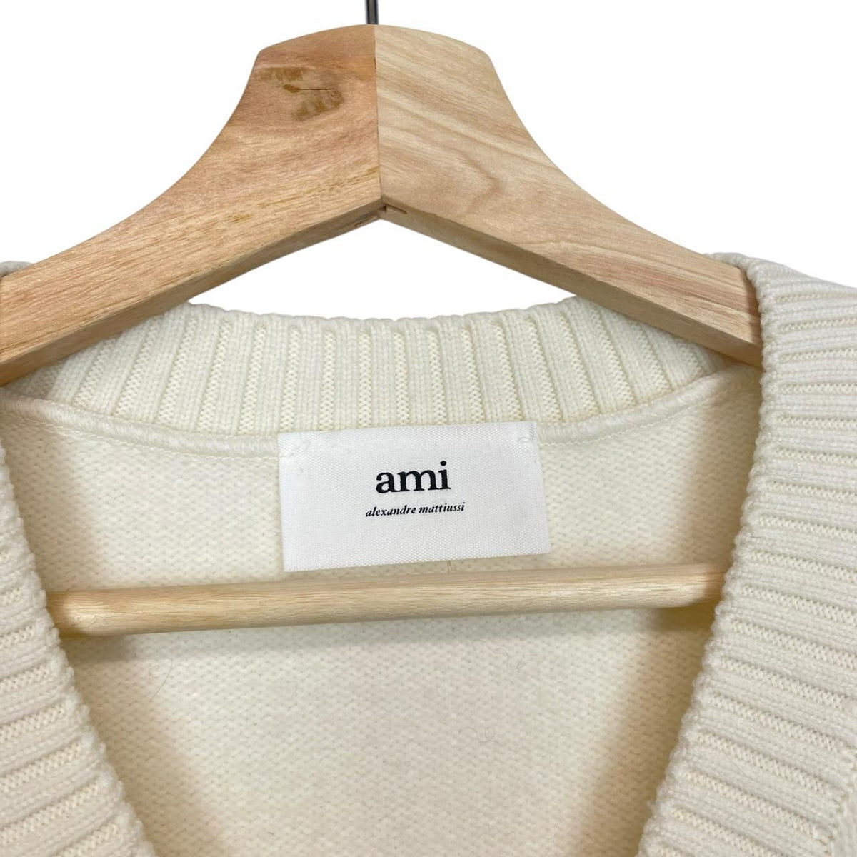 Ami Paris cream and red wool knit sweater vest with heart logo detail.