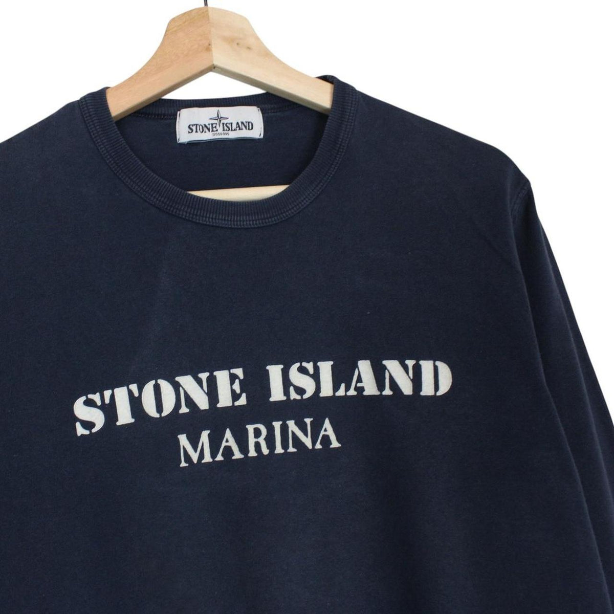 Stone Island navy blue sweatshirt with logo print and thin cotton material.
