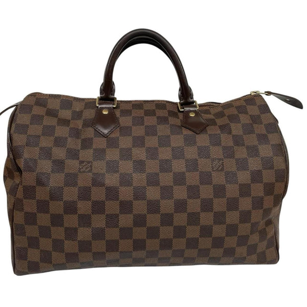 Louis Vuitton brown Damier Ebene canvas Speedy 35 bag with logo and gold-tone hardware.