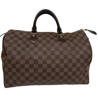 Louis Vuitton brown Damier Ebene canvas Speedy 35 bag with logo and gold-tone hardware.