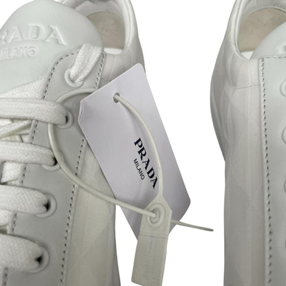 Prada white trainers Re-Nylon and brushed leather with logo detail and dust bags.