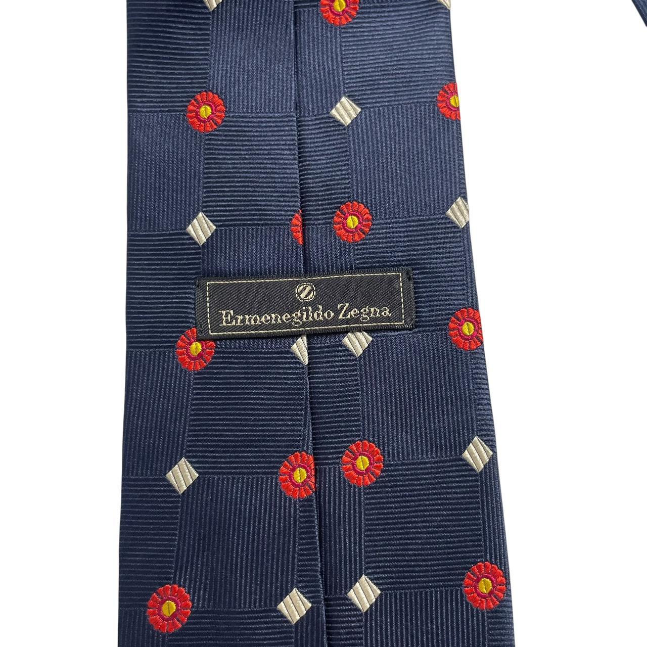 Ermenegildo Zegna navy blue silk tie with subtle sheen and elegant texture.
