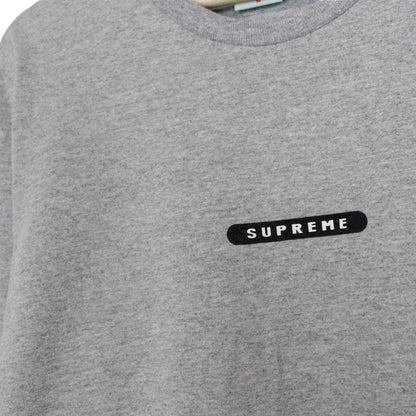 Supreme grey and pink long sleeve cotton t-shirt with wild print and pocket detail.