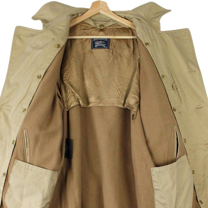 Burberry beige trench coat with Nova Check pattern, double breasted and belted design.