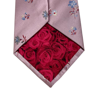 Paul Smith pink silk tie with floral embroidery and signature logo detail.