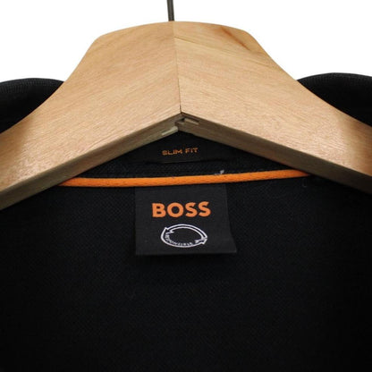 Hugo Boss black long sleeve polo shirt, slim fit, cotton material, subtle wear marks.