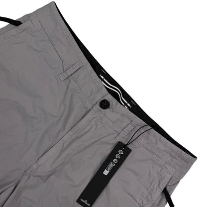 Stone Island grey cargo shorts with logo patch and multiple pockets in cotton material.