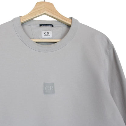 CP Company grey cotton sweatshirt with logo patch and ribbed cuffs.