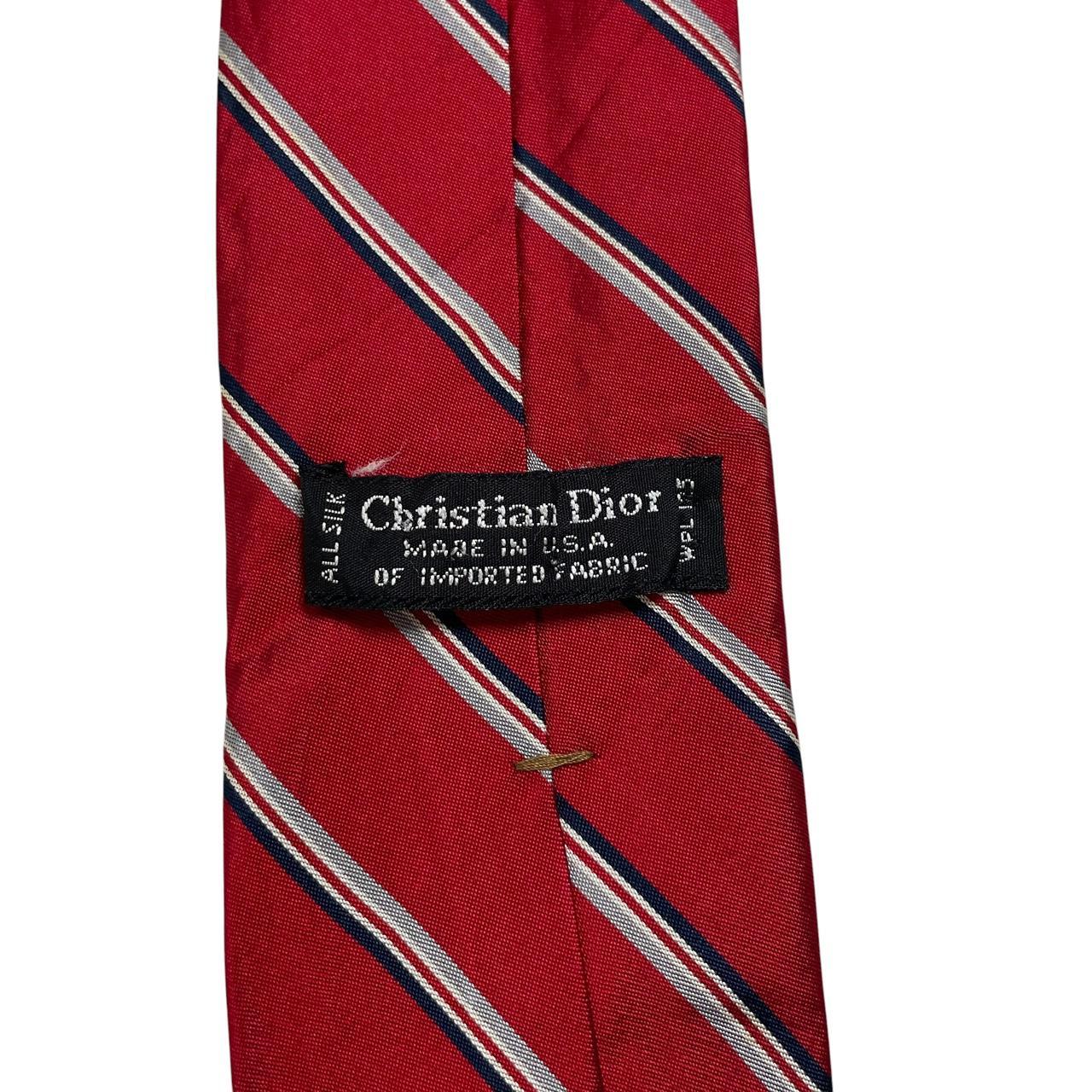 Christian Dior red striped silk tie with subtle marks and classic design.