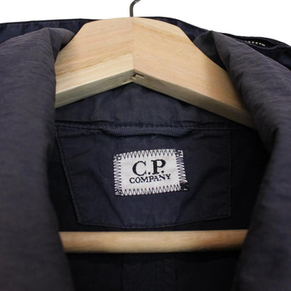 CP Company navy blue nylon jacket with multi pockets and garment dyed finish.