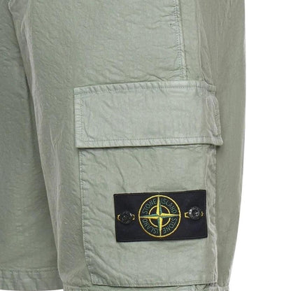 Stone Island green cargo shorts with multiple pockets and "OLD" effect garment-dye treatment.