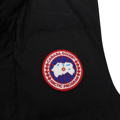 Canada Goose black down gilet with logo patch and durable exterior shell.