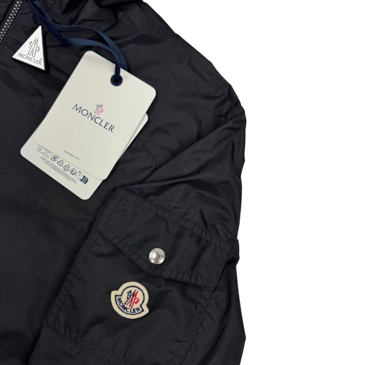 Moncler black windbreaker jacket, full zip, hooded, nylon material, logo on chest.