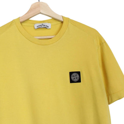 Stone Island yellow short sleeve cotton t-shirt with compass logo and soft fabric.