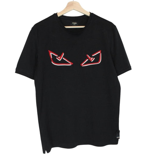 Fendi black cotton t-shirt with red Bag Bug eyes graphic and pocket detail.