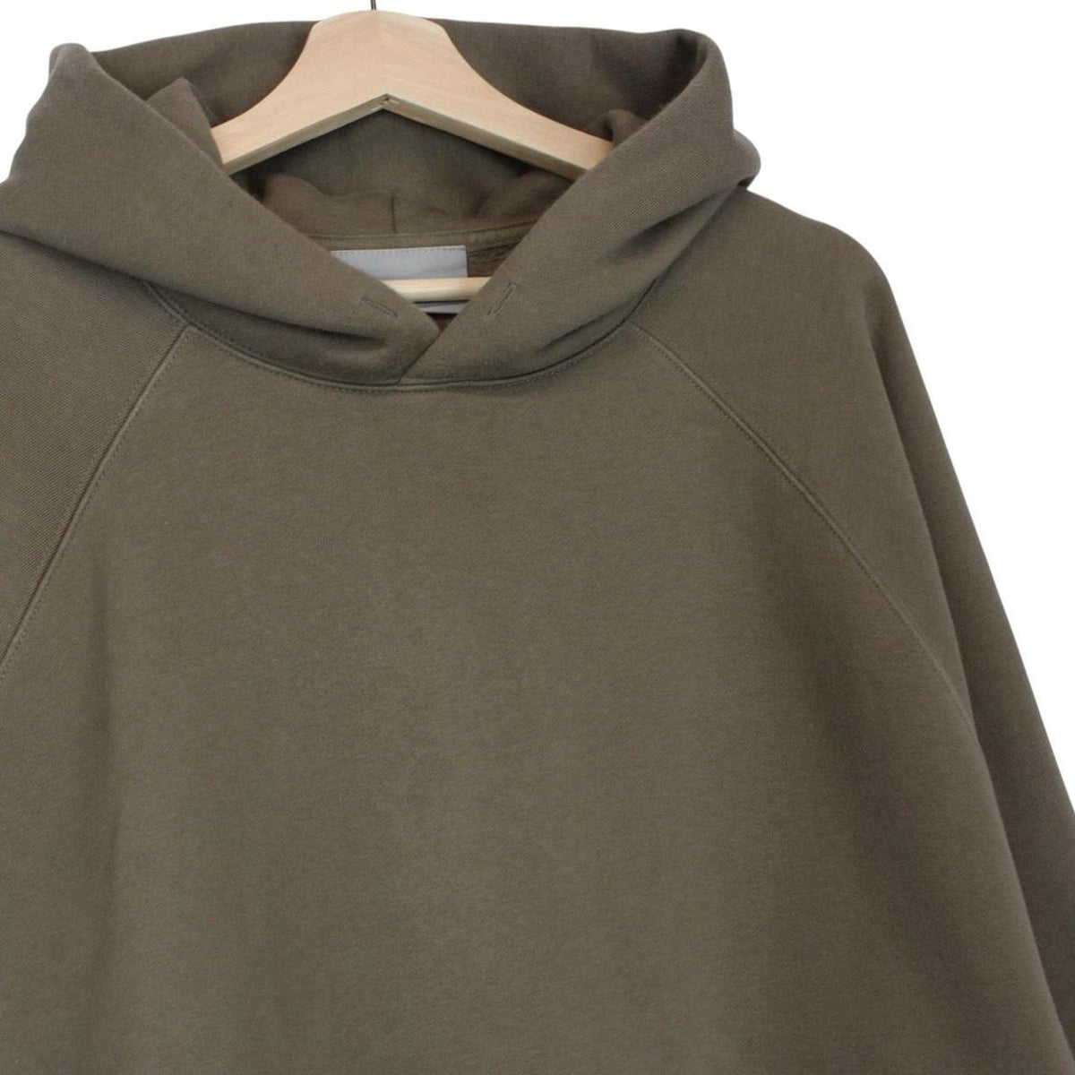 Essentials brown hoodie jumper with logo, oversized fit, soft cotton material.