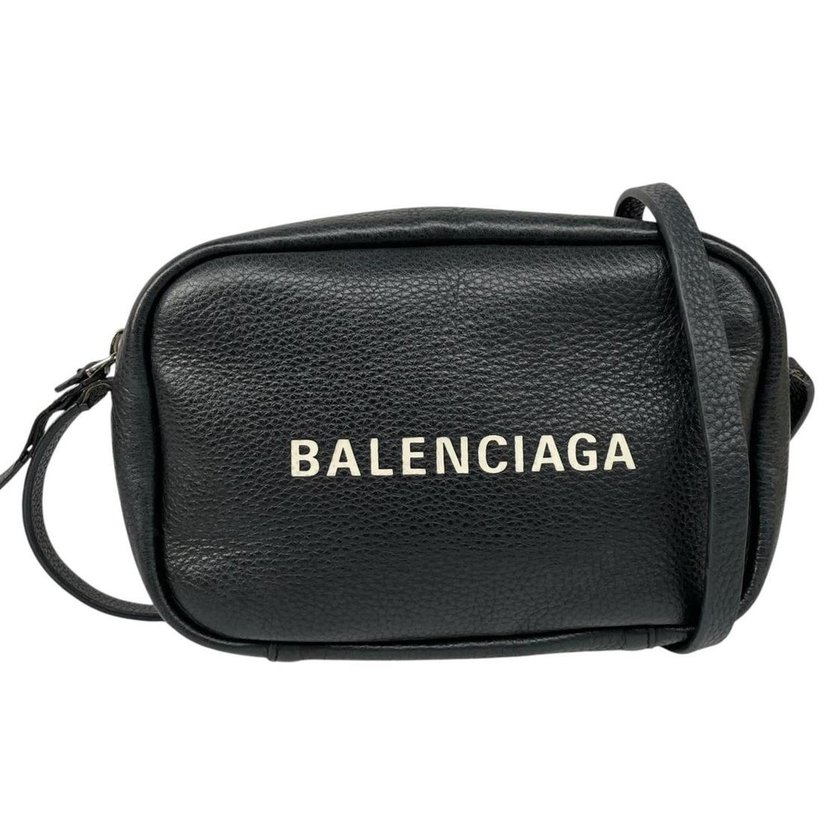 Balenciaga black leather messenger bag with embossed logo and minimalistic design.