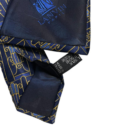 Lanvin silk tie featuring floral geometric print in vibrant colors.