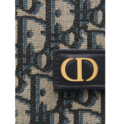 Dior blue card holder featuring Oblique jacquard pattern and dandelion design.