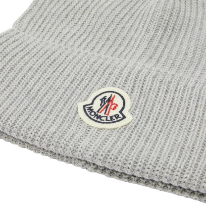 Moncler grey ribbed cotton beanie hat with logo patch and brand tags.