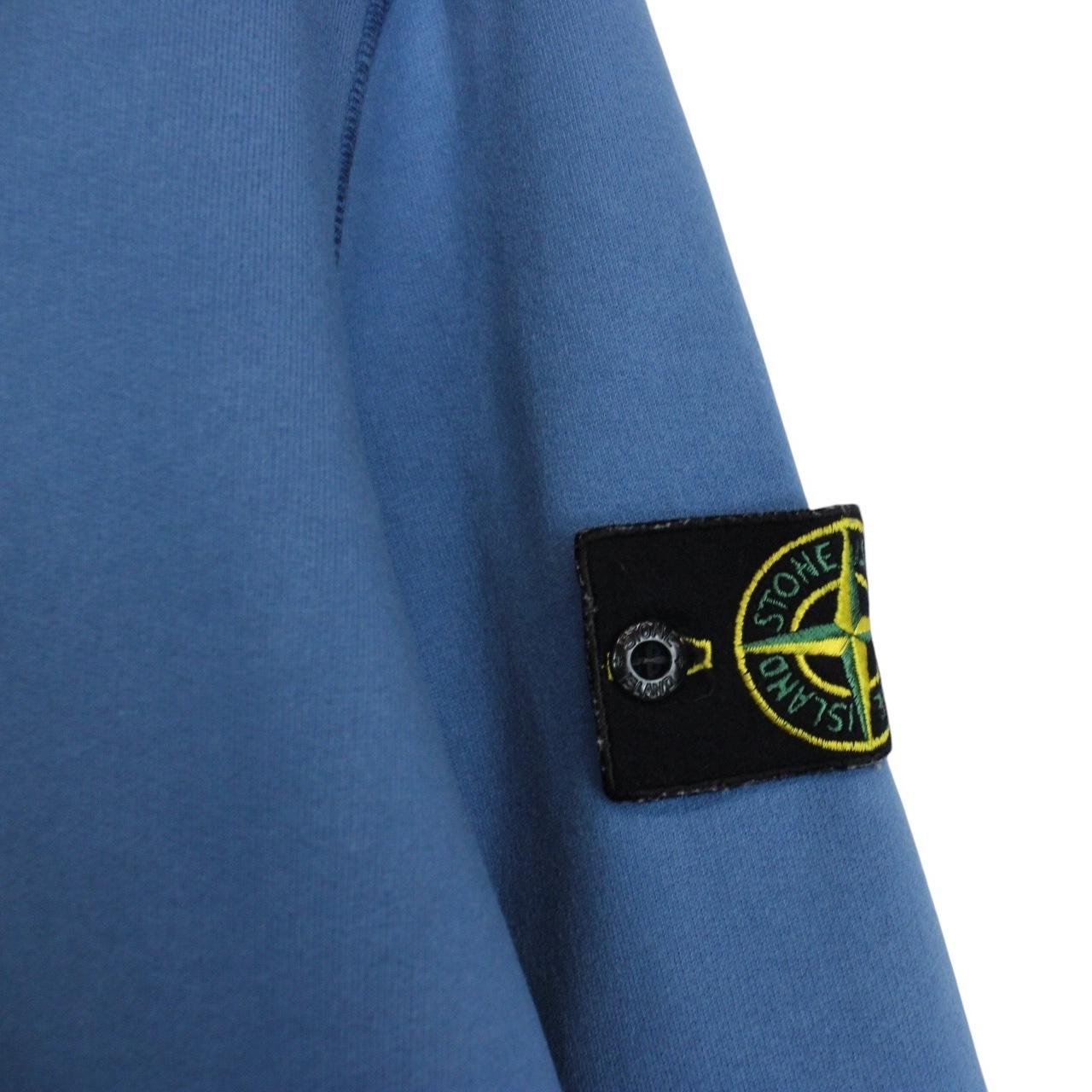 Stone Island blue cotton sweatshirt with embroidered logo and slight wear marks.