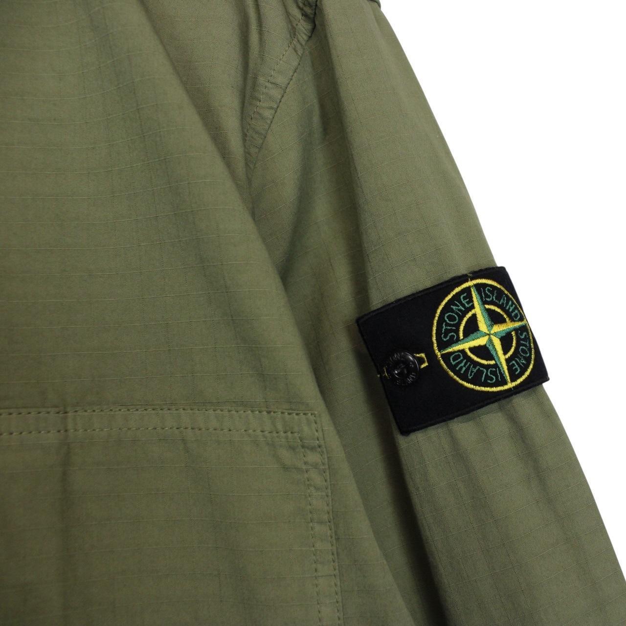 Stone Island green ripstop full zip overshirt jacket with logo patch and cotton material.