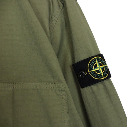 Stone Island green ripstop full zip overshirt jacket with logo patch and cotton material.