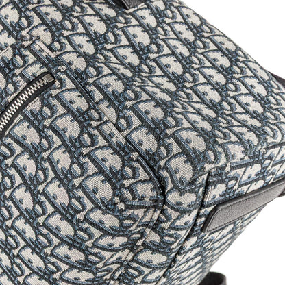 Dior beige and black oblique jacquard monogram rider backpack with logo pattern.