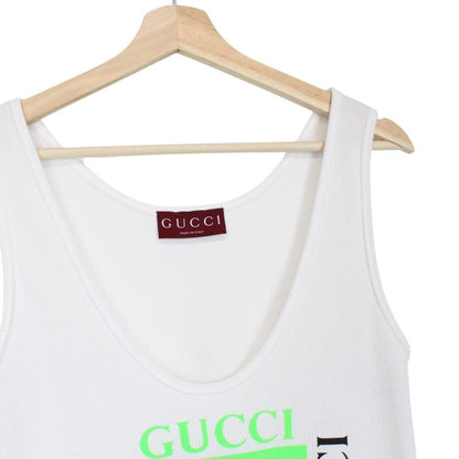 Gucci white tank top featuring bold logo print on soft cotton material.