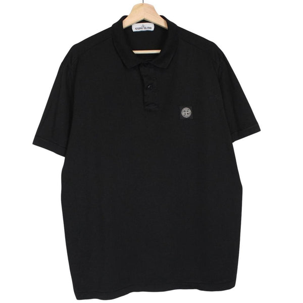 Stone Island black polo shirt with embroidered compass logo and cotton material.