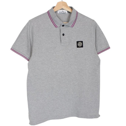 Stone Island grey polo shirt with embroidered compass logo and cotton material.