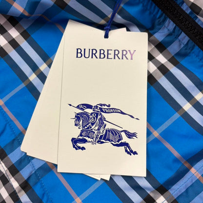 Burberry reversible windbreaker jacket in blue and black with Nova Check pattern.