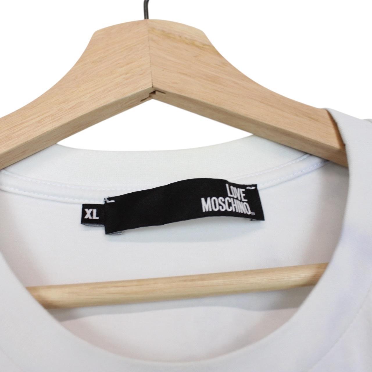 Moschino white pocket t-shirt with digital peace print and faint back stain.