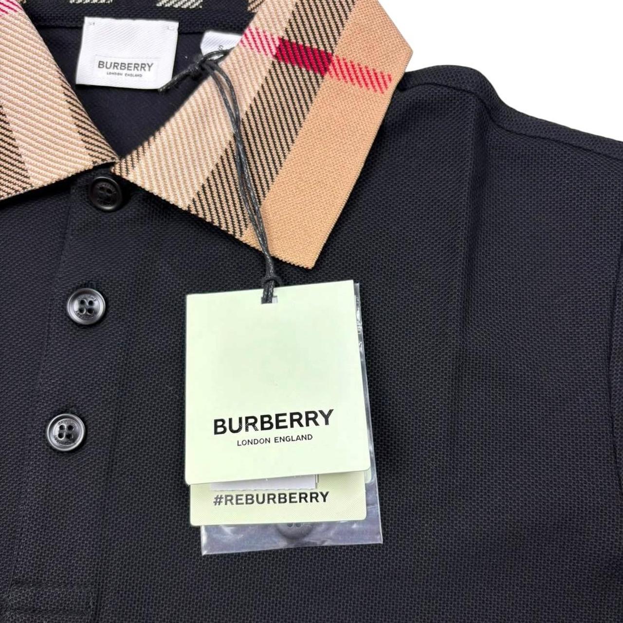 Burberry beige polo shirt with black Nova Check collar and cotton material.