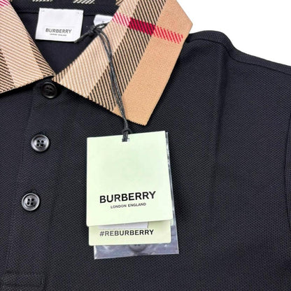 Burberry beige polo shirt with black Nova Check collar and cotton material.