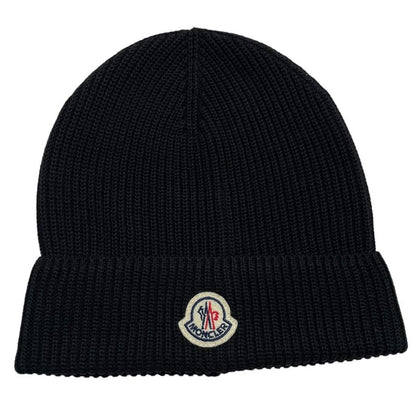 Moncler black ribbed knit beanie hat with embroidered logo detail.