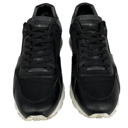 Louis Vuitton black trainers featuring monogram pattern and leather-mesh material.
