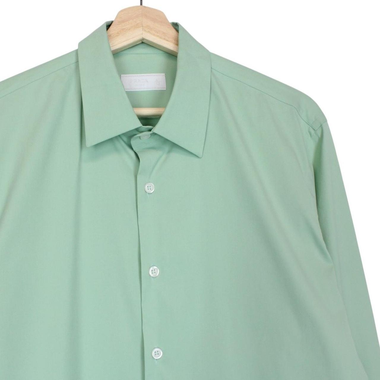 Prada green long sleeve shirt with popeline stretch fabric and logo detail.