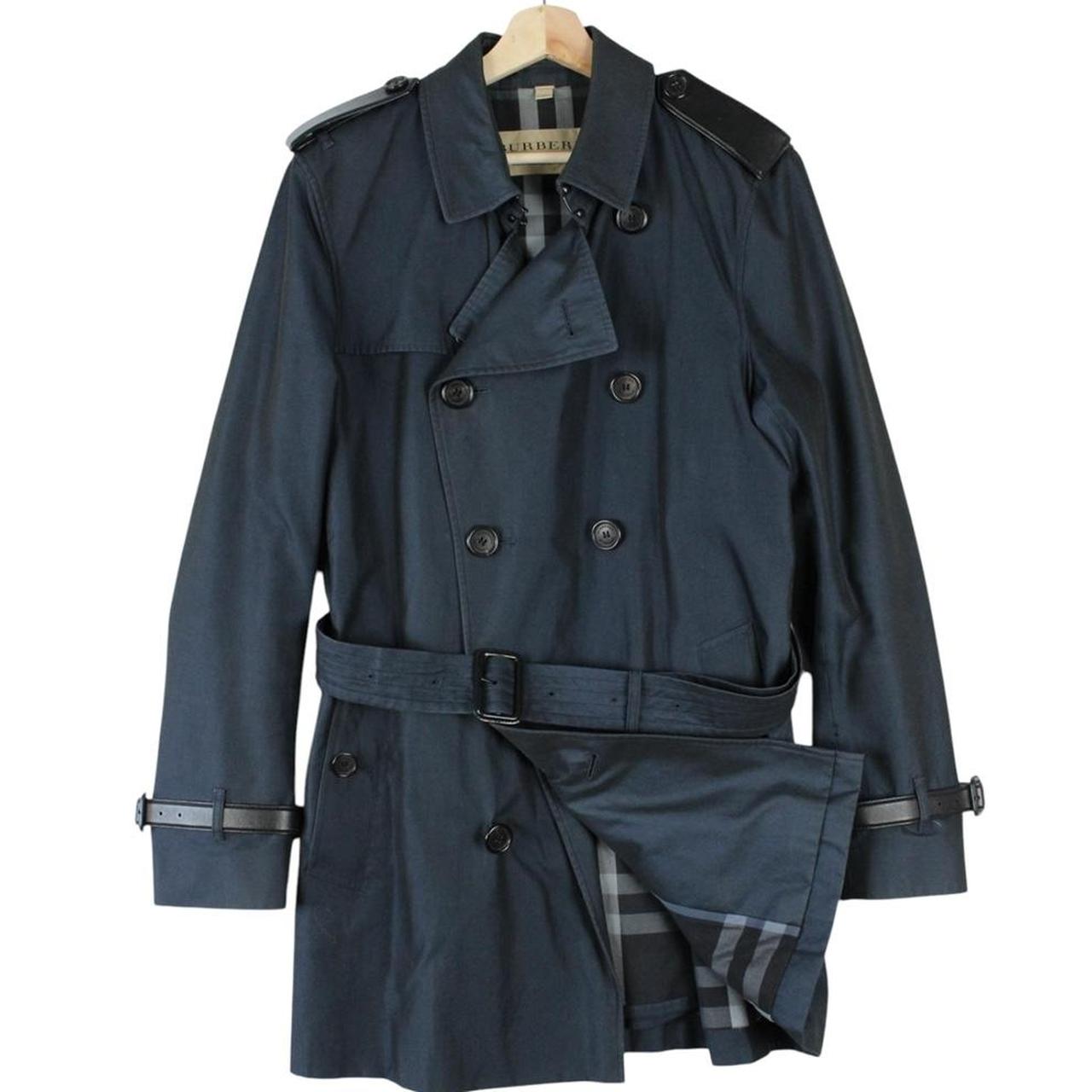 Burberry navy blue trench coat with Nova Check pattern and double-breasted design.
