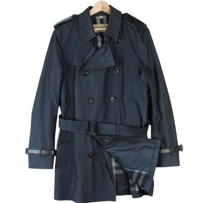 Burberry navy blue trench coat with Nova Check pattern and double-breasted design.