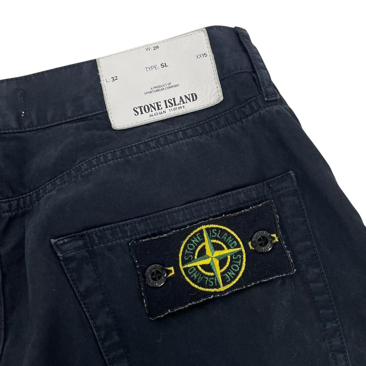Stone Island black slim fit cotton trousers with iconic compass logo patch.