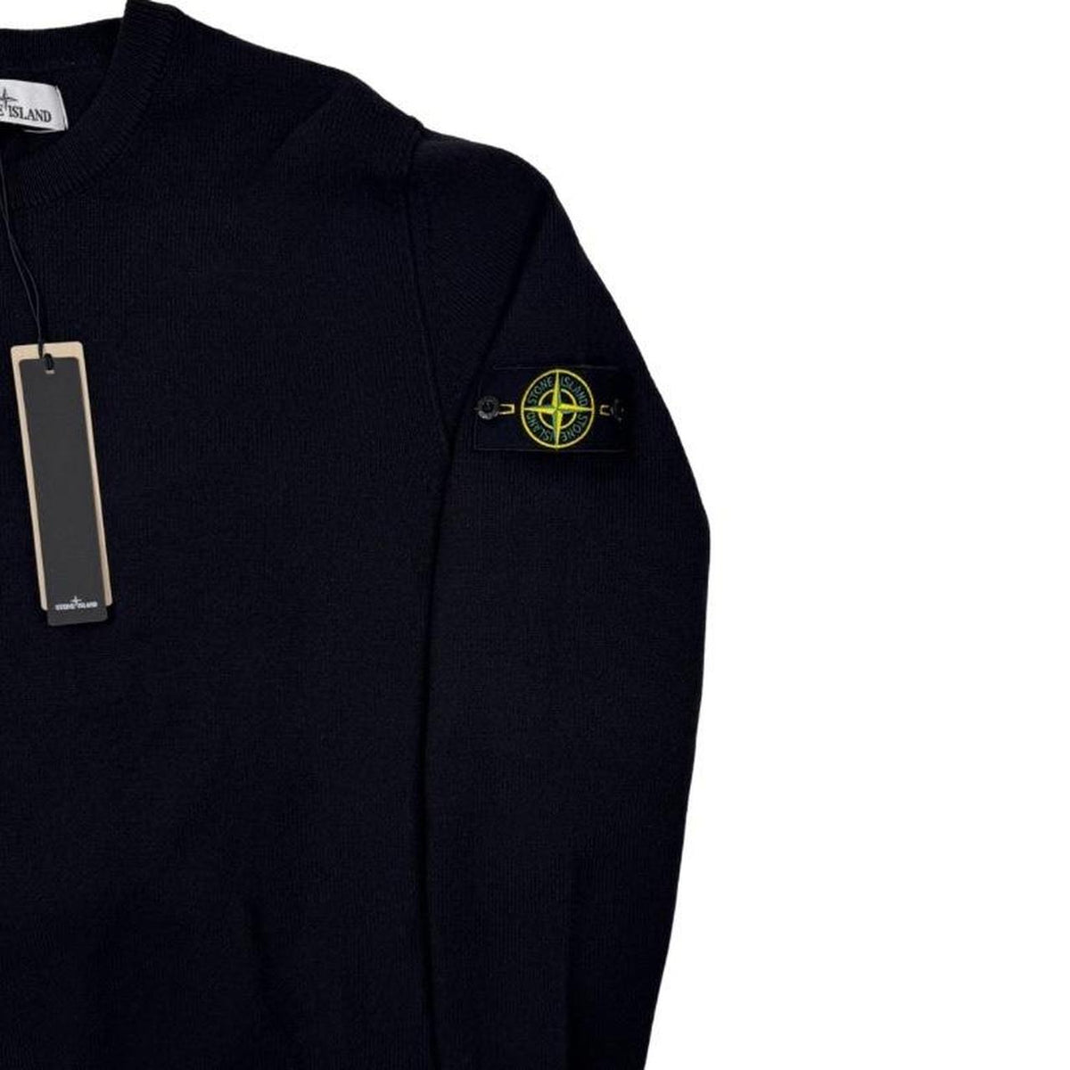 Stone Island black knit jumper with logo patch and organic cotton material.