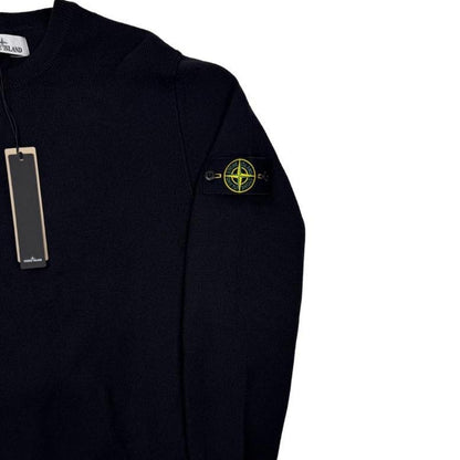 Stone Island black knit jumper with logo patch and organic cotton material.