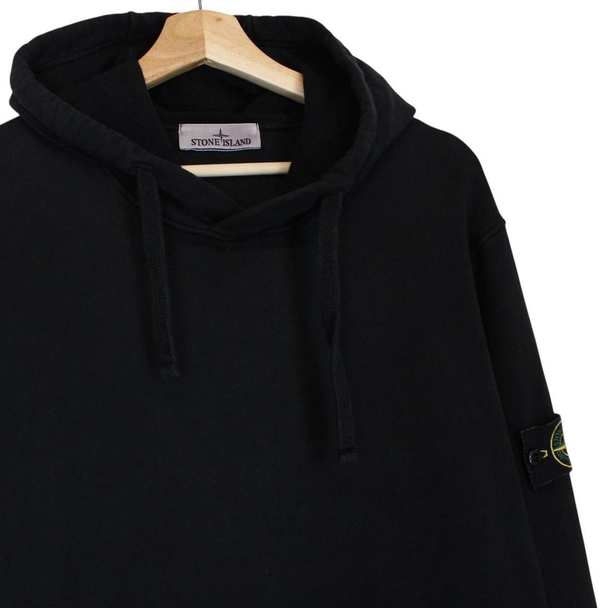 Stone Island black hoodie jumper with embroidered logo and cotton material.